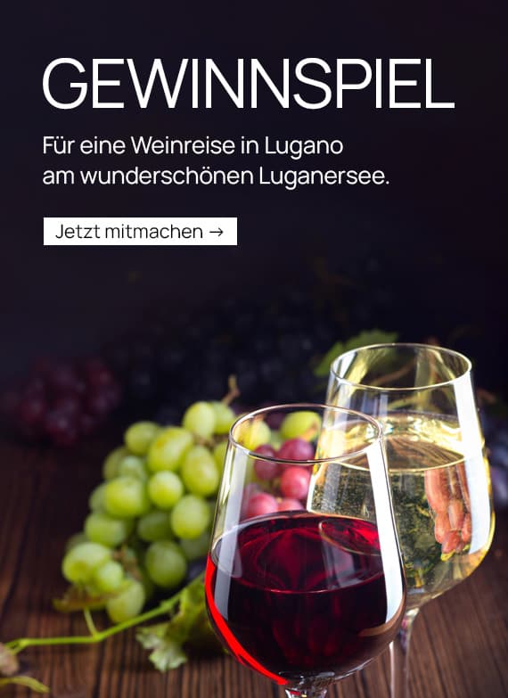Gewinnspiel – Weinreise nach Lugano am Luganersee, zwei Gläser Wein vor grünen und roten Trauben